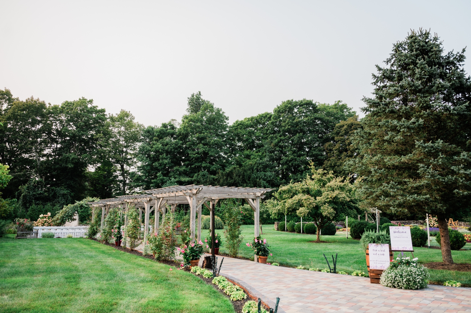 The trellis-covered walkway at Salem Herbfarm, an ourdoor wedding venue in New England 