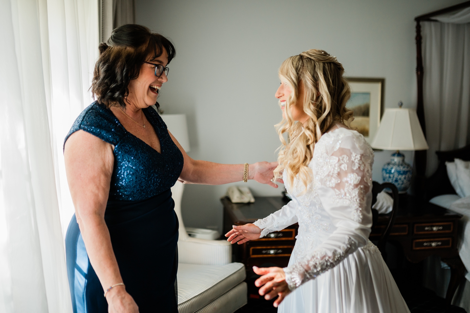 A bride surprises her mother by wearing her wedding dress